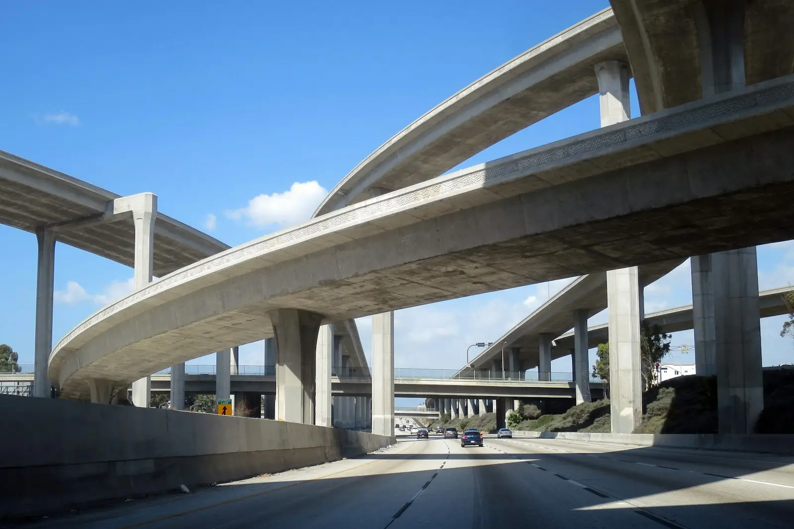 Los Angeles freeway passing under a tall interchange
